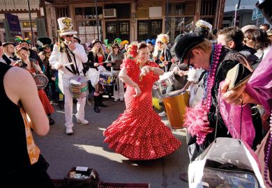 Woman in flamenco dress dancing in New Orleans to illustrate European business schools ‘should not get into US-style culture wars’