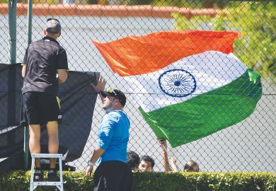 The Indian flag flies as ground staff erect netting in front as a metaphor that  Some Antipodean universities face an existential threat from the loss of Indian students.