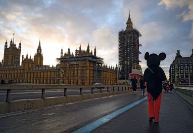 A man in a Mickey Mouse costume walks past the Houses of Parliament, London, United Kingdom A man in a Mickey Mouse costume walks past the Houses of Parliament to illustrate ‘Mickey Mouse degrees’ rhetoric expected to survive Tory rebuild