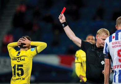 Referee  gives a red card  during the Dutch Eredivisie match 