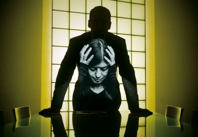 Shadow person standing at desk with image of lady holding her head  within the shadow body shape Shadow person standing at desk with image of lady holding her head  within the shadow body shape