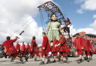 Giant puppet being walked throughout Liverpool, England Giant puppet being walked throughout Liverpool, England to illustrate DSIT creation brings fear over ‘political direction’ of research