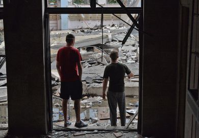 Workers inspect the damage after a Russian missile hits the National Technical University in Kharkiv, Ukraine  Workers inspect the damage after a Russian missile hits the National Technical University in Kharkiv, Ukraine to illustrate Ukrainian staff report high anxiety and little institutional help