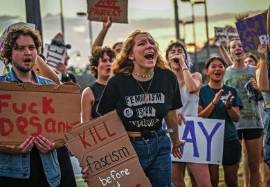 LGBTQ rights supporters protest in Fort Myers, Florida LGBTQ rights supporters protest in Fort Myers, Florida to illustrate 'US states restricting LGBTQ rights face exodus of students'