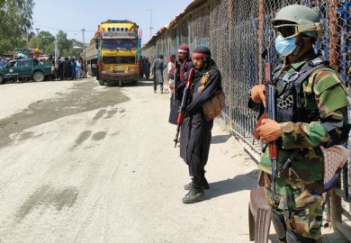 Taliban and Pakistani security guards at the Torkham border crossing Taliban and Pakistani security guards at the Torkham border crossing as a metaphor for Get at-risk research collaborators out of Afghanistan, UK told