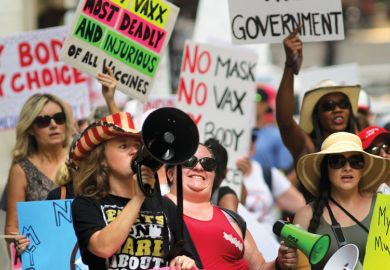 Anti-vaccine and anti-mask mandate protesters shouting holding banners in Massachusetts as Biden threatens to withhold funding from colleges over vaccines