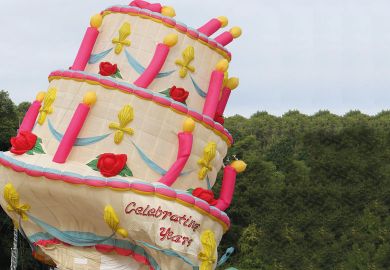 Deflated hot air balloon in the shape of a birthday cake at the 40th annual Bristol International Balloon Fiesta to illustrate Doubts over future of science department if Labour wins election