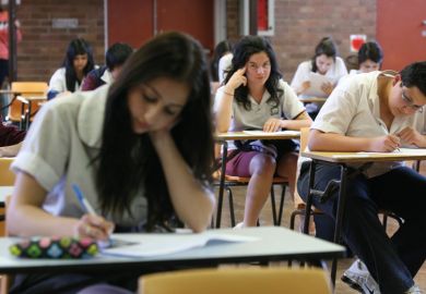 Students taking exams Students taking exams to illustrate Australian universities stick with ‘unfair’ early entry schemes