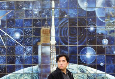 A man walks past a space mural depicting a rocket launch in Beijing, China A man walks past a space mural depicting a rocket launch in Beijing, China to illustrate China’s Young Thousand Talents fails to attract ‘top’ scientists