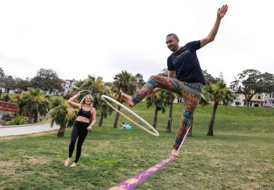 Person with a hula hoop on a  tightrope practicing his skills Person holding a hula hoop on a  tightrope practicing his skills to illustrate Want to improve students’ grades? Teach them life coping skills