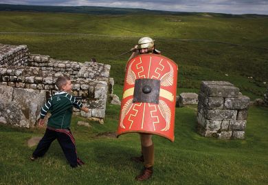 Re-enactment soldier at Housesteads Fort on Roman Hadrian's Wall, to illustrate Universities shun school mentoring ‘to guard global reputation’