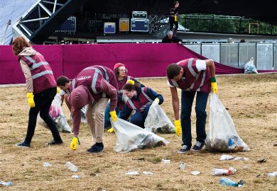 A team of litter pickers clearing up the morning after a music festival - Wilderness, Cornbury, Oxfordshire, UK  A team of litter pickers clearing up the morning after a music festival - Wilderness, Cornbury, Oxfordshire, UK to illustrate Time to bin all REF open access rules, say Oxford research chiefs