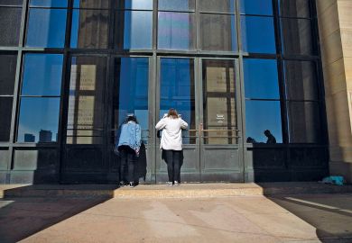 Visitors look inside the closed Philadelphia Museum of Art Visitors look inside the closed Philadelphia Museum of Art to illustrate Private US college closures look to gain public attention
