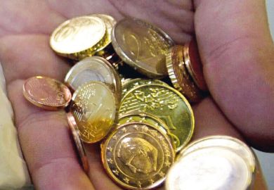 Hand full of Euro coins in Belgium Hand full of Euro coins in Belgium to illustrate Ghent offers flat research grants
