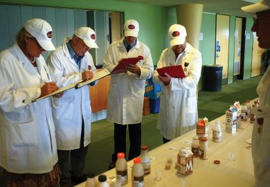 Judges at the Sydney Royal Cheese and Dairy Produce Show assess flavoured milk products Judges at the Sydney Royal Cheese and Dairy Produce Show assess flavoured milk products