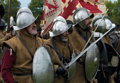 Participants dressed as Spanish army infantry soldiers prepare for battle in the Netherlands to illustrate Irish and Dutch education reforms ‘threaten university autonomy’