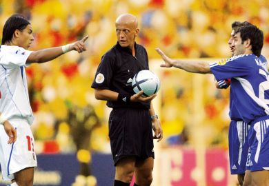 Footballers arguing with the referee in the centre Footballers arguing with the referee in the centre to illustrate