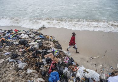 Piles of discarded textile waste on the shores of Chorkor beach in Accra, Ghana to illustrate Ashesi pivots to tackle new African challenges