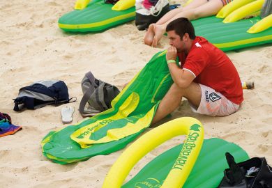 Person with deflated lilo at Bondi Beach, Sydney to illustrate Appetite for master’s study stays sluggish in Australia