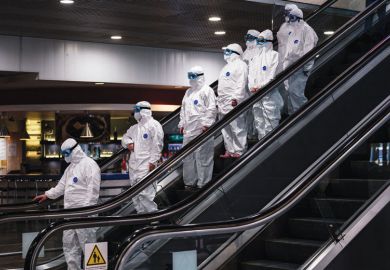 Medical staff wearing protective suits ride down an escalator  Medical staff wearing protective suits ride down an escalator for Leadership turnover rate could double