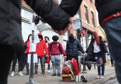 Friends visit a memorial for a student who was shot in Chicago, Illinois Friends visit visit a memorial for a student who was shot in Chicago, Illinois