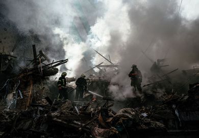Ukrainian firefighters push out a fire after a strike in Zaporizhzhia   Ukrainian firefighters push out a fire after a strike in Zaporizhzhia  to illustrate Pseudo science has fuelled the bloodshed in Ukraine