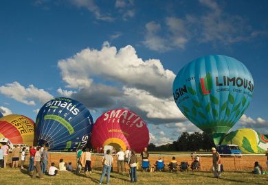 Hot air ballons being inflated to illustrate France urged to expand university places after equality warning