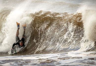 A surfer on a small board falls on a wave A surfer on a small board falls on a wave to illustrate Australian migration rules ‘risk international education crisis’