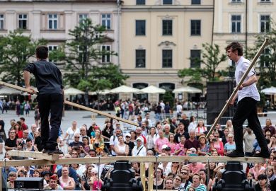 Street performers in Krakow, Poland to illustrate Polish academics ambivalent about Tusk government one year in