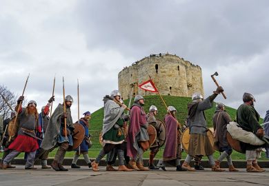 Viking re-enactors march through York to illustrate UK recruitment woes spur new bout of cuts 