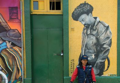 Woman standing in front of door, Santiago, Santiago Metropolitan Region, Chile Woman standing in front of door, Santiago, Santiago Metropolitan Region, Chile