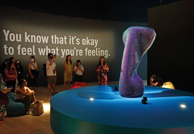 Visitors look at the installation called Doing Nothing With AI (2019) by Emanuel Gollob during a media preview  Visitors look at the installation aclled Doing Nothing With AI (2019) by Emanuel Gollob during a media preview to illustrate Cautious experiment with AI in student counselling gets under way