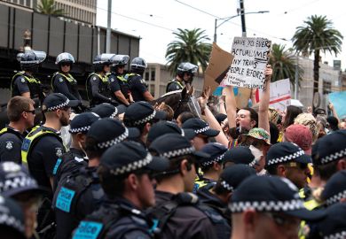 Police hold back counter-protesters at a Trans Exclusionary Radical Feminist (TERF) rally from event  as described in the article