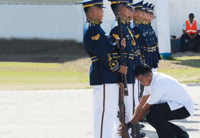 A presidential guard inspects members of the honor guard A presidential guard inspects members of the honor guard to illustrate hilippines military training for students ‘aims at stifling dissent’