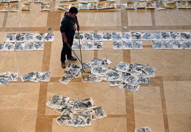 Student's exam papers being swept up from the floor to illustrate China journal crackdown ‘a band-aid rather than a cure’