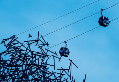 Cable cars run past the 'Quantum Cloud' sculpture to illustrate Academics need to get better at knowing when to move on