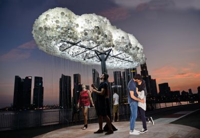 Cloud light art installation people walking with a couple kissing in front Cloud light art installation people walking with a honeymoon couple in front to illustrate Is the honeymoon period over for liberal arts in Asia?