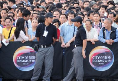 People wait for the opening of a new casino outside the City of Dreams complex in Macau People wait for the opening of a new casino outside the City of Dreams complex in Macau to illustrate University of Macau edging us out, international academics fear