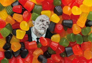 Trolls head surrounded by sweets to illustrate Universities must help scholars targeted by trolls