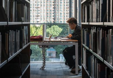 A student studies in the library at the New York University Shanghai campus, China.