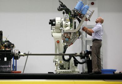 Man at machinery at the Advanced Manufacturing Research Centre.