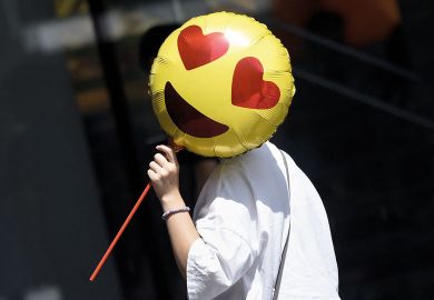A woman holds a heart emoji balloon to illustrate Rosier outlook for UK sector finances with pension changes excluded