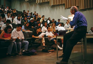 Montage of a professor giving a lecture with a magic glove, hat and white rabbit to illustrate If live lectures die, how will the true magic of shared endeavour be conjured up?