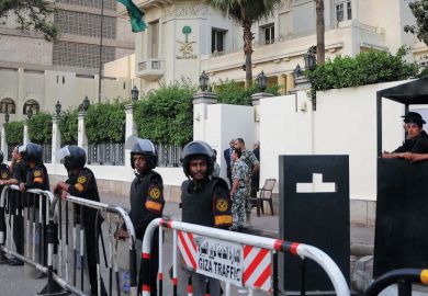 Egyptian security forces stand guard outside the Saudi embassy. Egyptian security forces stand guard outside the Saudi embassy as a metaphor that a University of Washington doctoral student is being detained in Egypt.