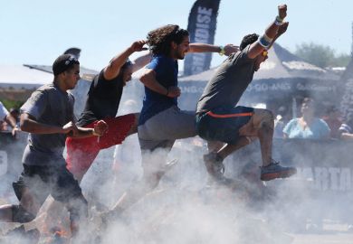 Competitors in action at the fire jump obstacle during the Reebok Spartan Race. Mohegan Sun, Uncasville, Connecticut, USA. Competitors in action at the fire jump obstacle during the Reebok Spartan Race. Mohegan Sun, Uncasville, Connecticut, USA as a metaphor for the black colleges and universities (HBCUs) are on a run of rising public support, and student interest.