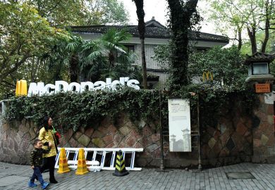 Tourists pass by a McDonald's  transformed from a house of Chiang Ching-kuo's villa to illustrate US diplomats may get research dollars to dole out in soft power bid