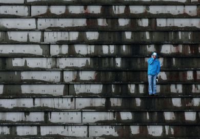 A single spectator waits for the start of an event in Oslo to illustrate Norwegian rectors fear course closures if overseas fees come in