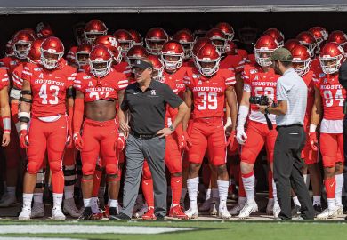 Houston head coach Dana Holgorsen prepares to lead the team onto the field to illustrate Let’s beef up post-tenure review – especially for football coaches