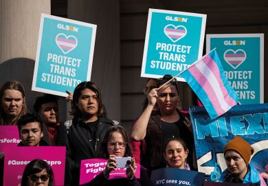 LGBT activists  rally in support of transgender people on the steps of New York City Hall LGBT activists  rally in support of transgender people on the steps of New York City Hall to illustrate Biden turns to transgender rights in discrimination rules redraft