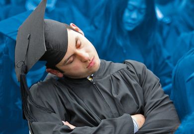 A graduate takes a snooze during his graduation ceremony as a metaphor for Pomp and monotony: why are graduation ceremonies so boring?